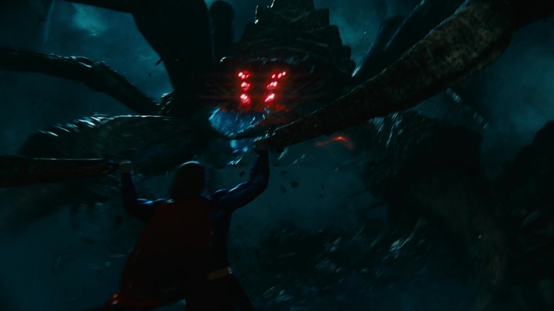 Superman fighting a giant spider in The Flash