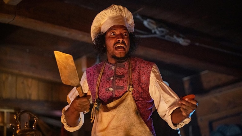 సాంబా షుట్టే రోచ్‌గా మా జెండాలో తన క్లీవర్‌ను పట్టుకోవడం అంటే మరణం