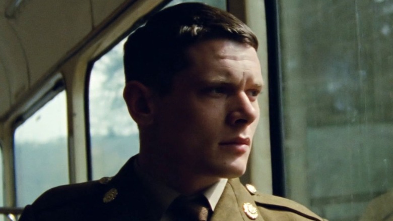 Jack O'Connell in '71 as Gary Hook looking out a window