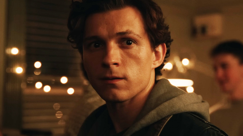 Tom Holland's Peter Parker looks worried in closeup in Spider-Man Brand New Day