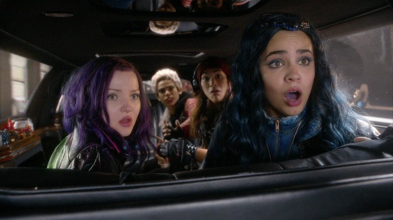 Mal, Carlos, Jay, and Evi in a limousine in Descendants