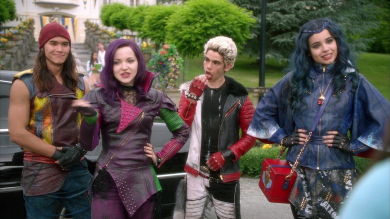 Jay, Mal, Carlos, and Evie standing in a line in Descendants