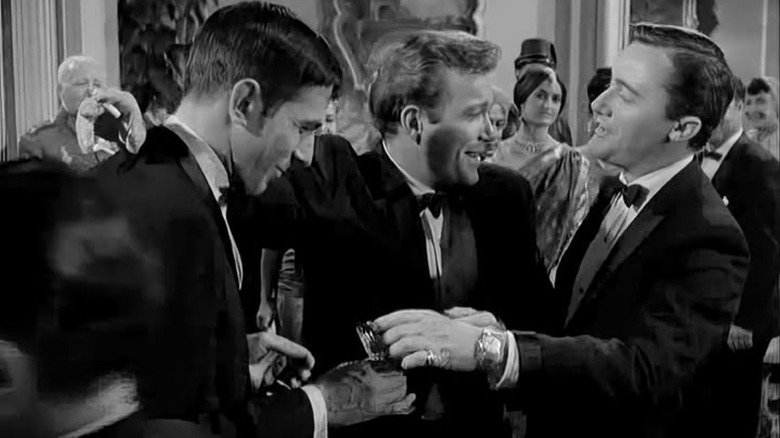 Vladeck, Michael Donfield, and Napoleon Solo chumming it up at a party in The Man from U.N.C.L.E.