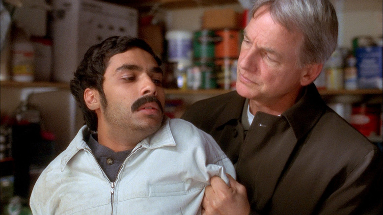 Mark Harmon Leroy Gyerse Gibs holds Youssef Zidan from Kunal Nayyar on NCIS