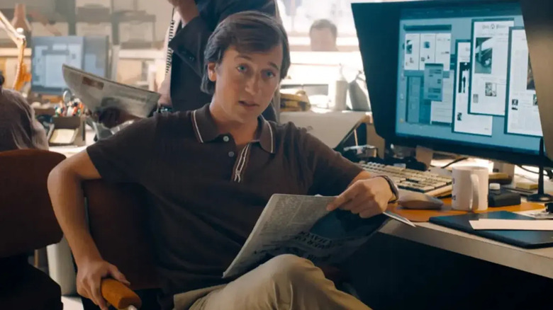 Jimmy Olsen at his desk in James Gunn's Superman