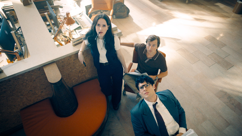 Lois, Jimmy, and Clark staring up at a TV screen in Superman