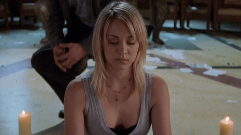 Billie Jenkins sitting in a candle circle on 