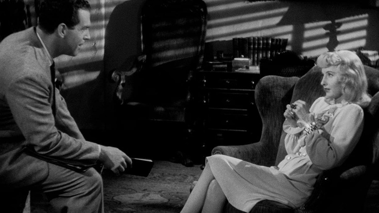 Walter and Phyllis sitting across from one another in Double Indemnity