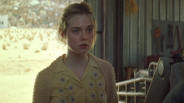 Elle Fanning's Mary Holm stands in a workshop in Young Ones