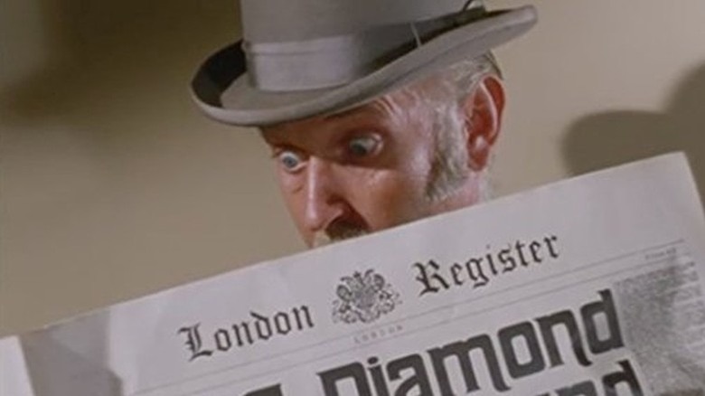 Gavin MacLeod as Phil Arnold reading a newspaper in the Death Valley Days episode The Great Diamond Mines
