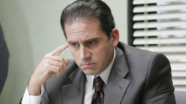 Steve Carell's Michael Scott wearing a grey suit in The Office