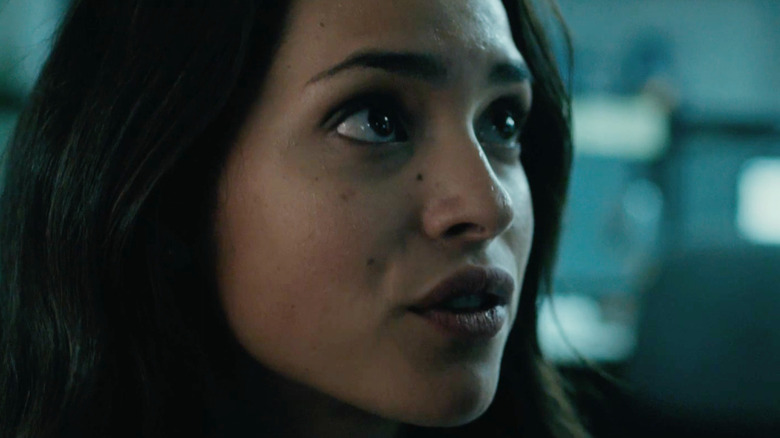 Leandra (Adria Arjona) talking quietly in The Belko Experiment