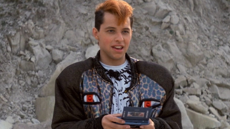 Lenny Luthor (Jon Cryer) holding a gadget in Superman IV: The Quest for Peace