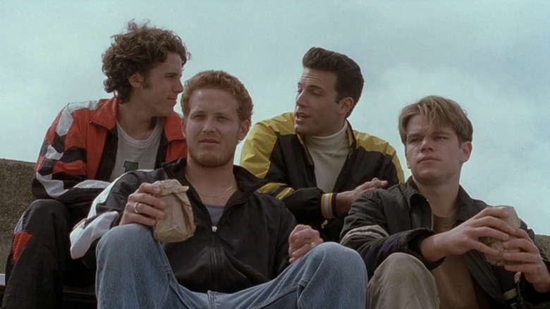Casey Affleck's Morgan O'Mally, Ben Affleck's Chuckie Sullivan, Cole Hauser's Billy McBride, and Matt Damon's Will Hunting sit together on bleachers in Good Will Hunting