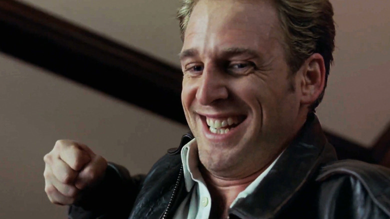 Josh Lucas's Glenn Talbot smiles as he raises his fist in Hulk