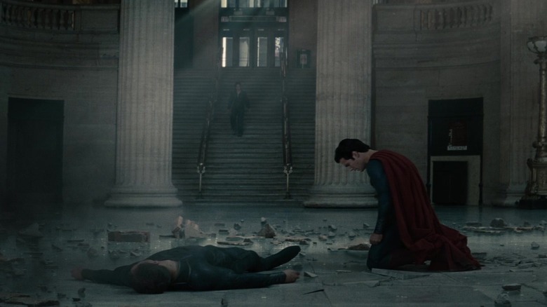 Henry Cavill's Superman kneels over the body of Michael Shannon's General Zod in Man of Steel
