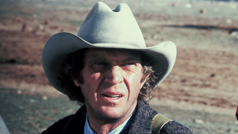 Tom Horn (Steve McQueen) squints while looking at the horizon in Tom Horn