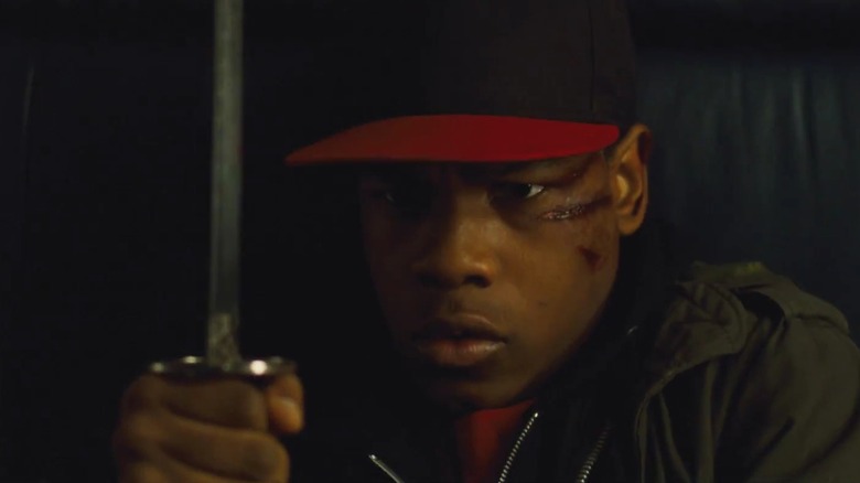 John Boyega holding a sword in Attack the Block
