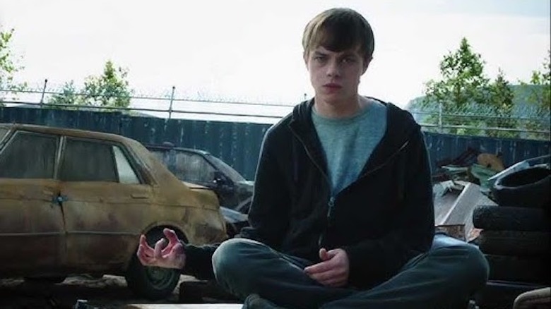 Andrew glowers in junkyard