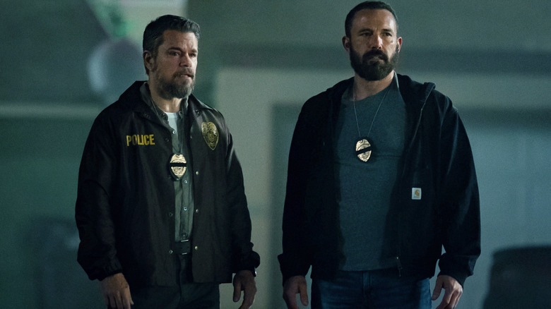 Matt Damon as Dane Dumars standing next to Ben Affleck as JD Byrne in The Rip