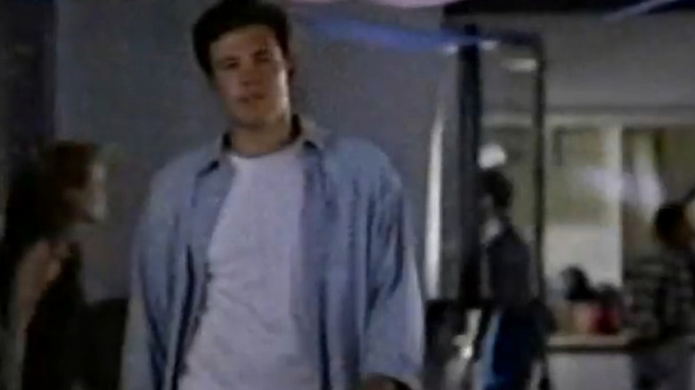 Joe Willie walking down a hallway in Against the Grain