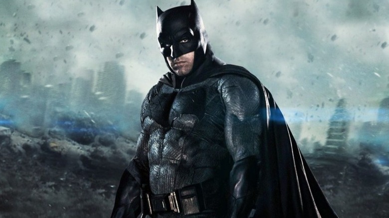 Batman posing on gargoyle statue in Justice League