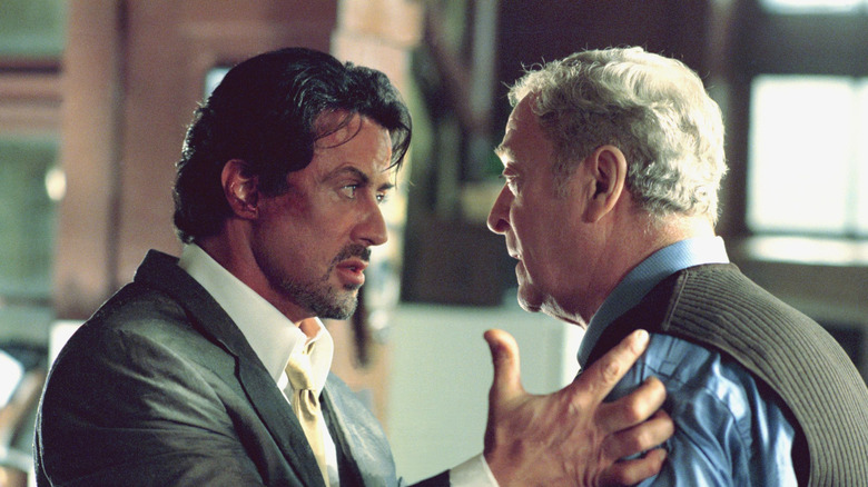 Sylvester Stallone as Jack Carter talking face to face with Michael Caine as Cliff Brumby in Get Carter (2000)