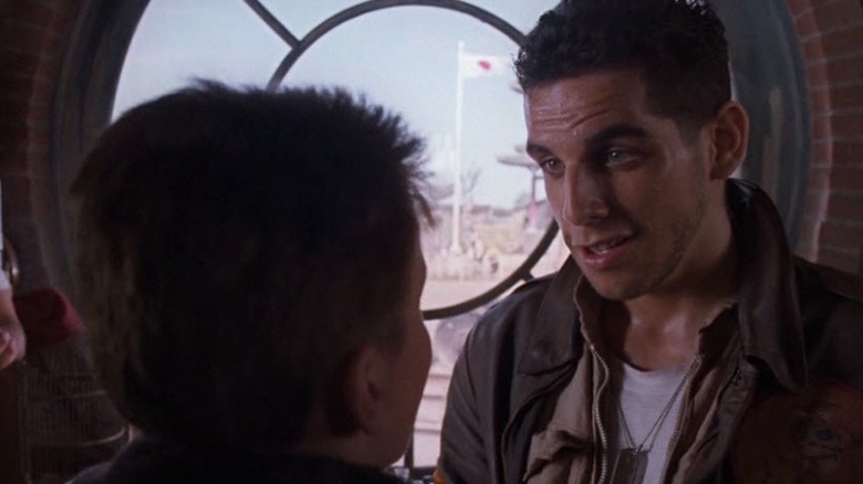 Prisoners of war Dainty and Basie talk young Jim while being held in a Japanese internment camp in "Empire of the Sun"