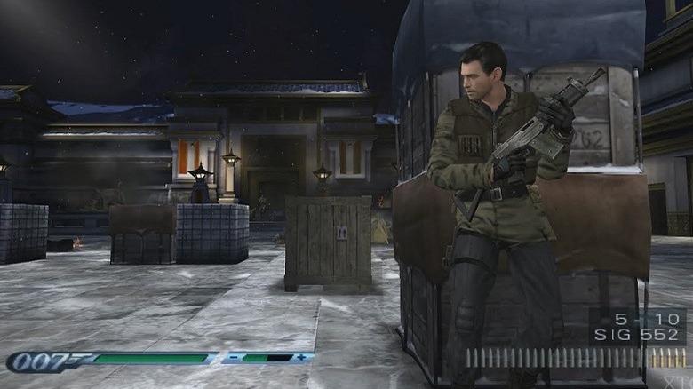 Bond takes cover behind some crates, dressed for combat