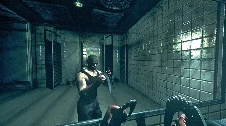 Riddick checks himself out in a mirror