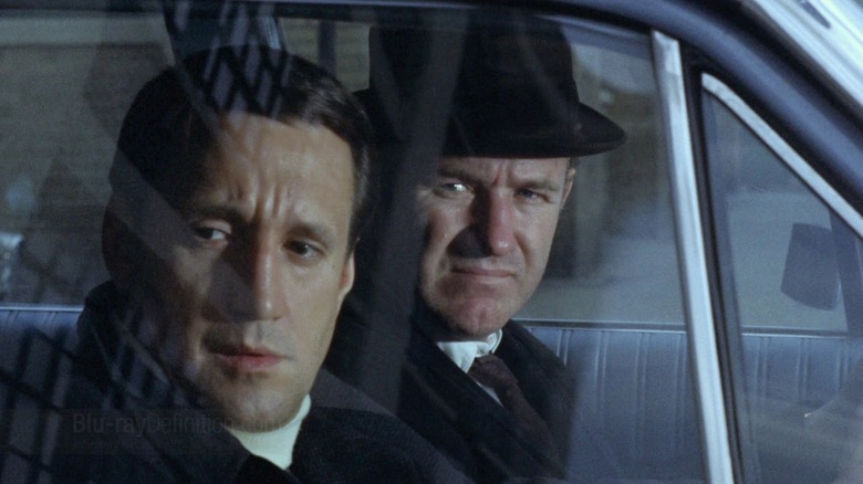 Roy Scheider as Cloudy and Gene Hackman as Popeye, staking out a villain in The French Connection