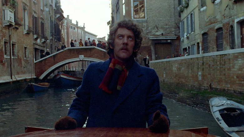John Baxter (Donald Sutherland) pilots a boat through a Venetian canal in Don't Look Now