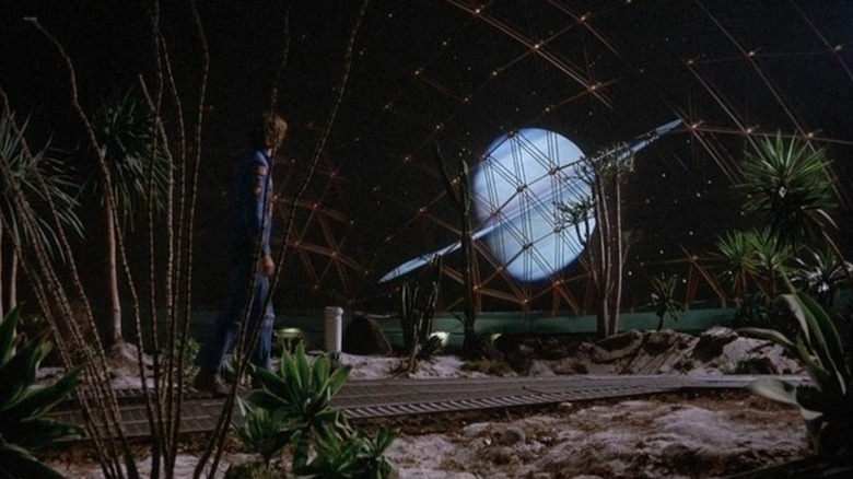 Freeman Lowell (Bruce Dern) observes Saturn through a greenhouse window in Silent Running