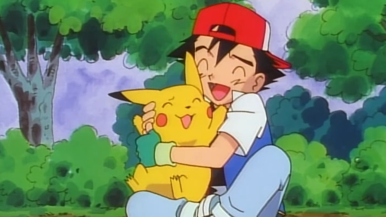 Ash Ketchum hugging Pikachu