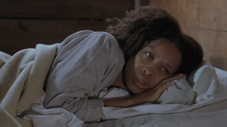 Rose (Erykah Badu) lying on bed in The Cider House Rules