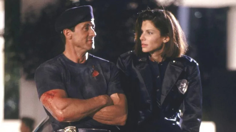 Sylvester Stallone's John Spartan and Sandra Bullock's Lenina Huxley take a post-action breather