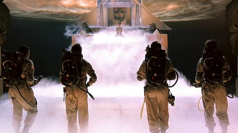 The Ghostbusters -- Ernie Hudson, Dan Aykroyd, Harold Ramis, and Bill Murray -- prepare to confront Gozer (Slavitza Jovan)