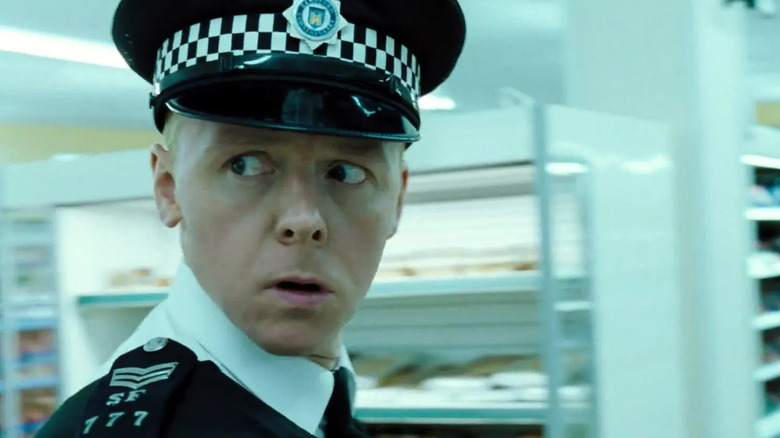 Simon Pegg's Nicholas Angel side-eyes something suspicious in Hot Fuzz