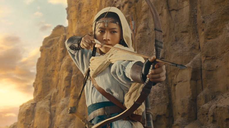 Chen Lijun as Ayuya with her bow and arrow pulled back in Blades of the Guardians