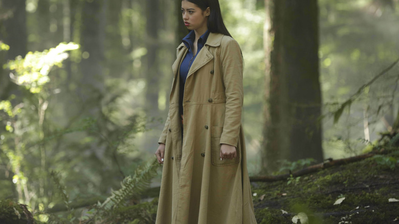 Midthunder in trenchcoat in forest