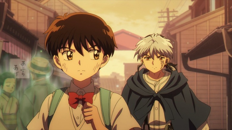 Nanoka Kiba walks in front of Mao through a ghostly market in Mao