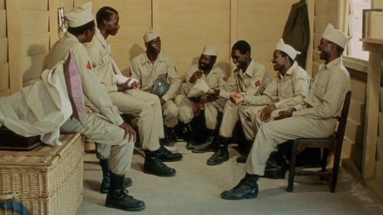 Soldiers sitting together in room in Camp de Thiaroye