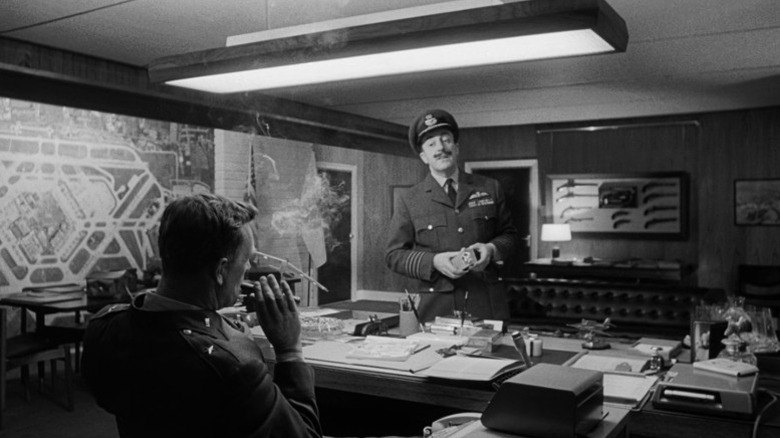 Sterling Hayden as Brigadier General Jack D. Ripper and Peter Sellers as Group Captain Lionel Mandrake talking in Dr. Strangelove