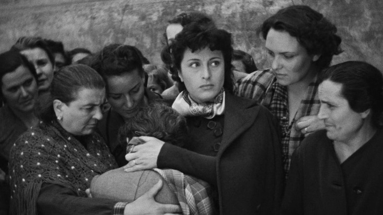 Women embracing on street in Rome, Open City