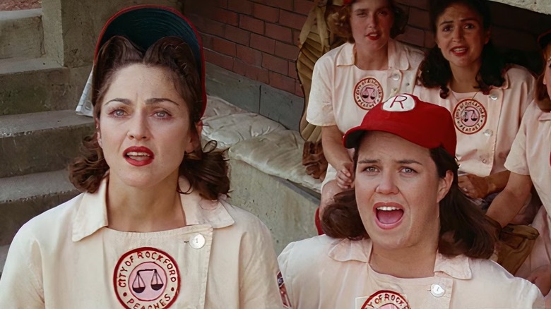 Mae Mordabito (Madonna) and Doris Murphy (Rosie O'Donnell) look up from the dugout in A League of Their Own