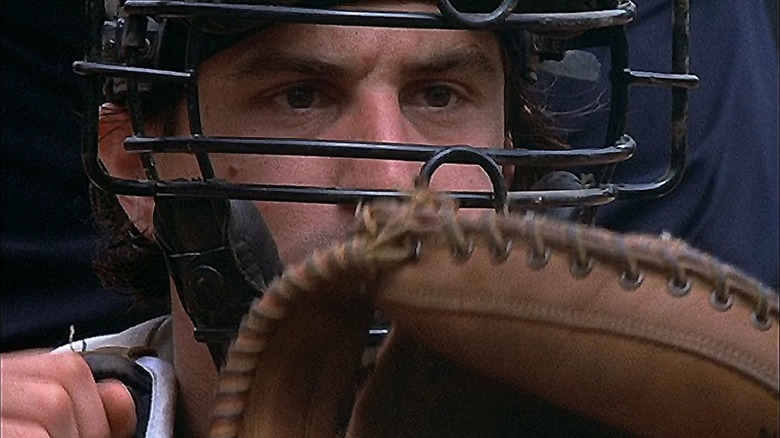 Bruce Pearson (Robert De Niro) sits ready with a catcher's mitt in Bang the Drum Slowly