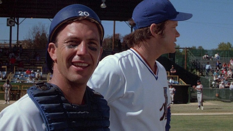 Crash Davis (Kevin Costner) and Nuke Laloosh) survey the ballpark on the field in Bull Durham