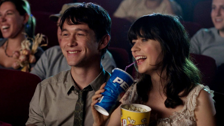 Joseph Gordon-Levitt and Zooey Deschanel as Tom and Summer laughing at the movies in (500) Days of Summer
