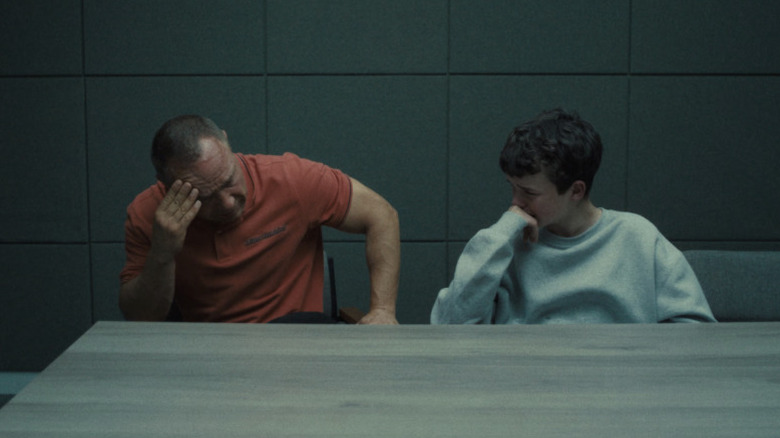 Stephen Graham and Owen Cooper as Eddie and Jamie crying in an interrogation room in Adolescence