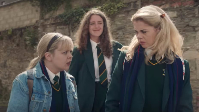 Nicola Coughlan, Louisa Harland, and Saoirse-Monica Jackson as Clare, Orla, and Erin in Derry Girls